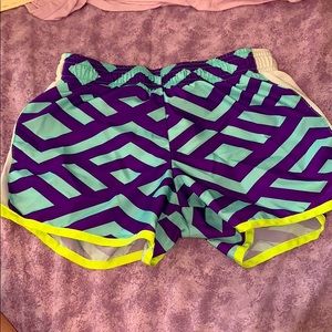 Purple teal white and neon green shorts